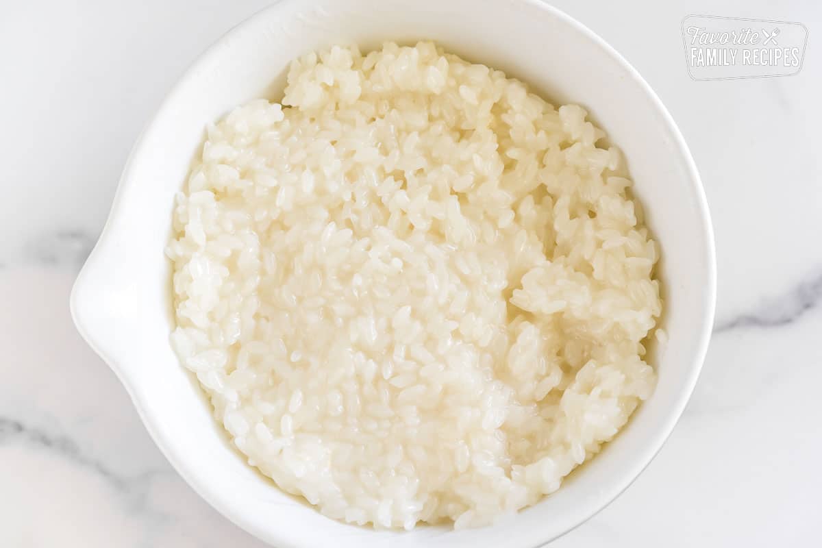 Sticky rice with coconut sauce in a small bowl