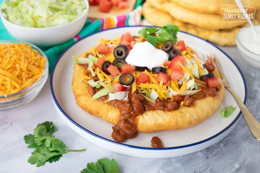 Navajo Taco on a plate with fork.