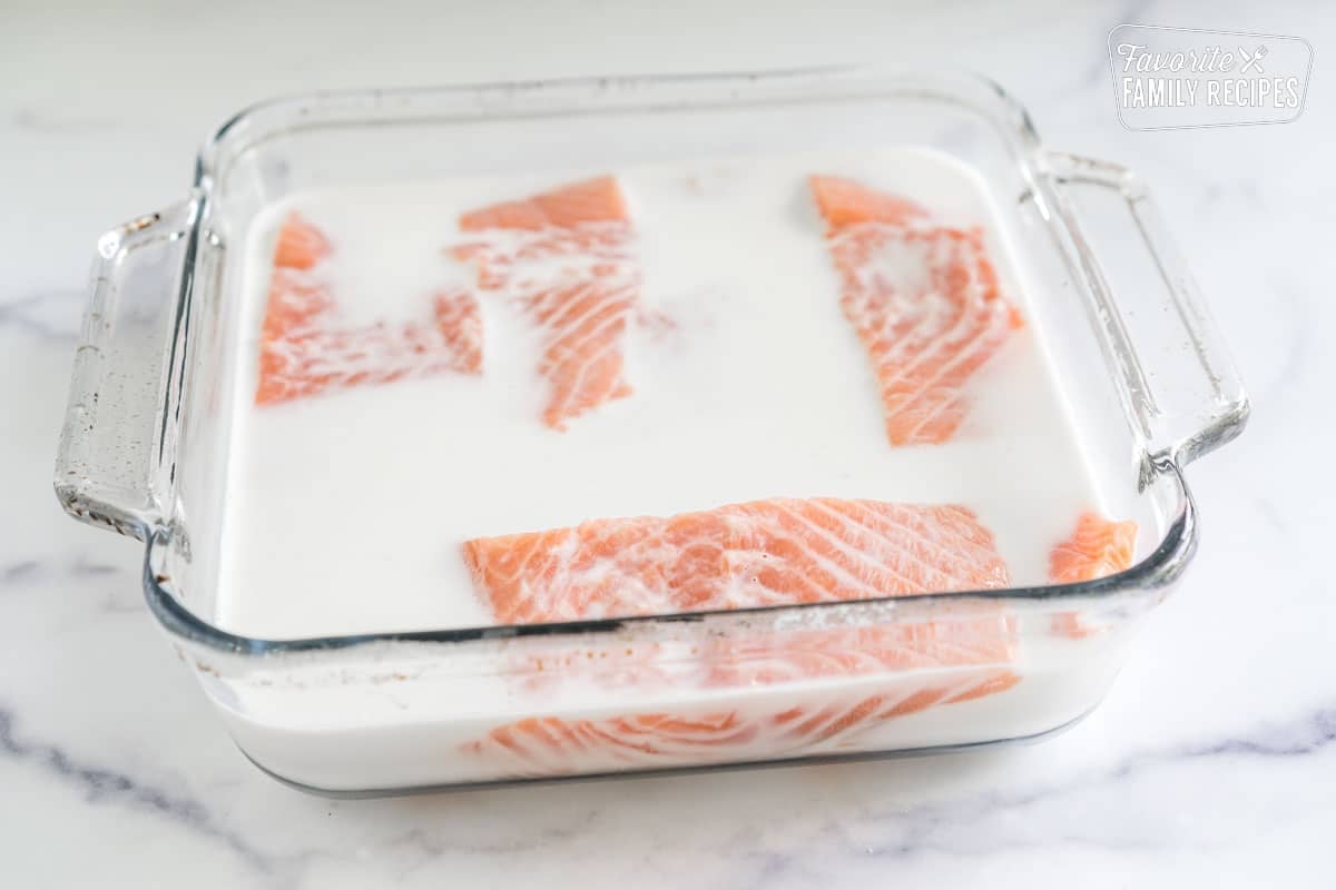 Salmon marinating in milk