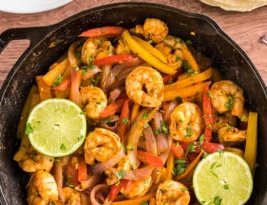 shrimp fajitas filing in a cast iron skillet