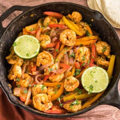 shrimp fajitas filing in a cast iron skillet