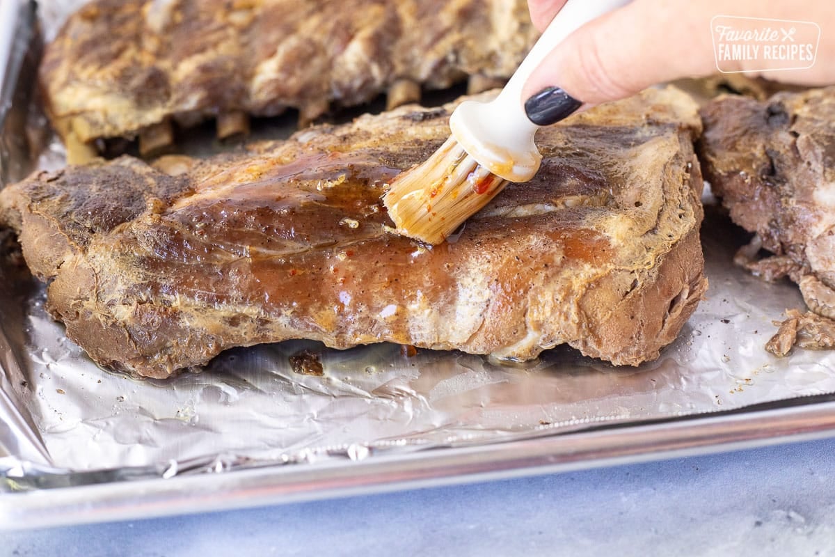 Brushing sauce on Crock Pot Ribs.