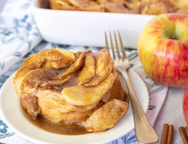 Plate of Caramel Apple French Toast Casserole with a fork.