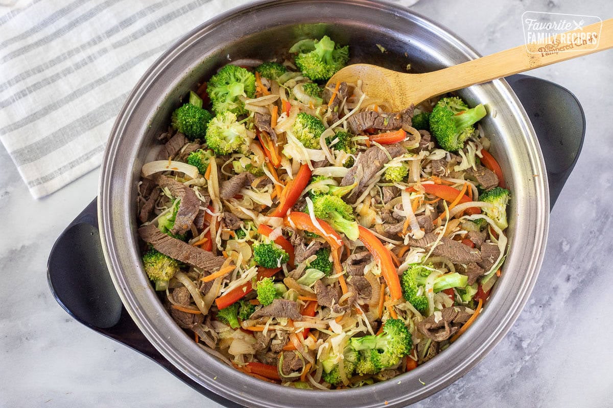 Skillet with beef and vegetables cooking for Beef Stir Fry.