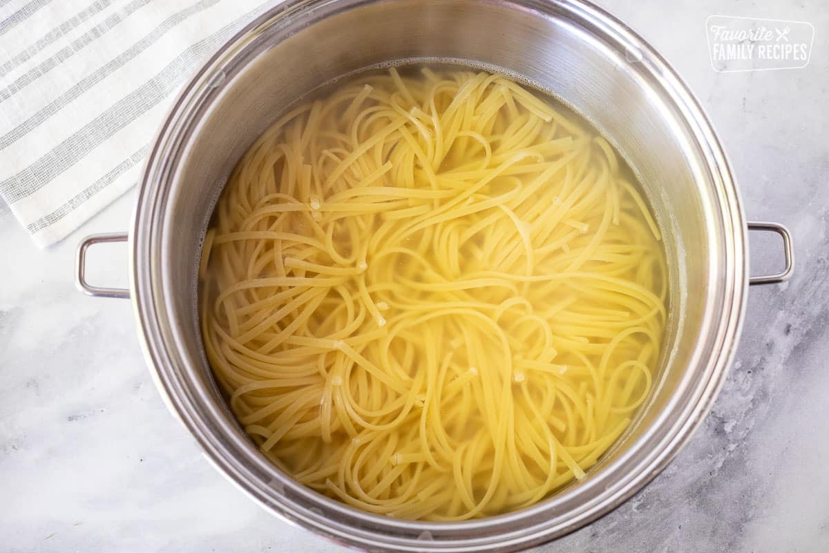 Pot with cooked linguine for Beef Stir Fry.