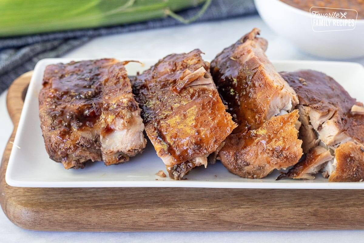 Cut sections of Crock Pot Ribs on a plate.