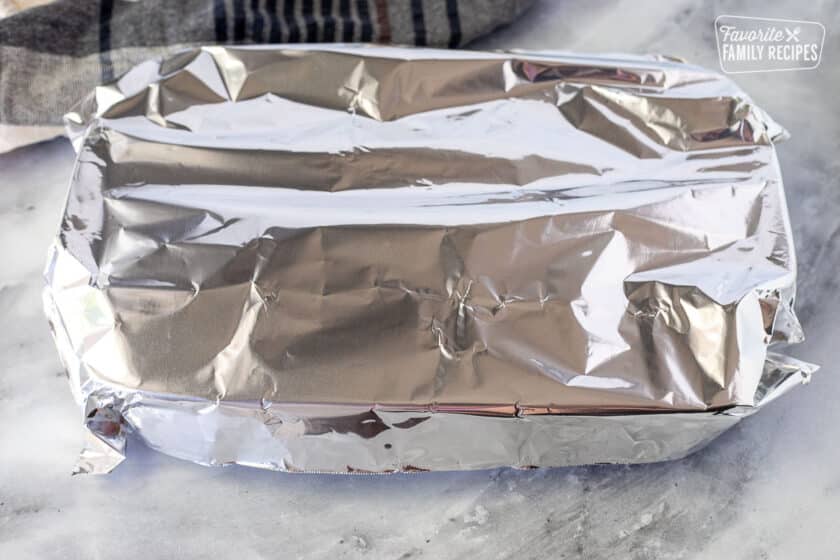 Foil over baking dish of White Chicken Lasagna.