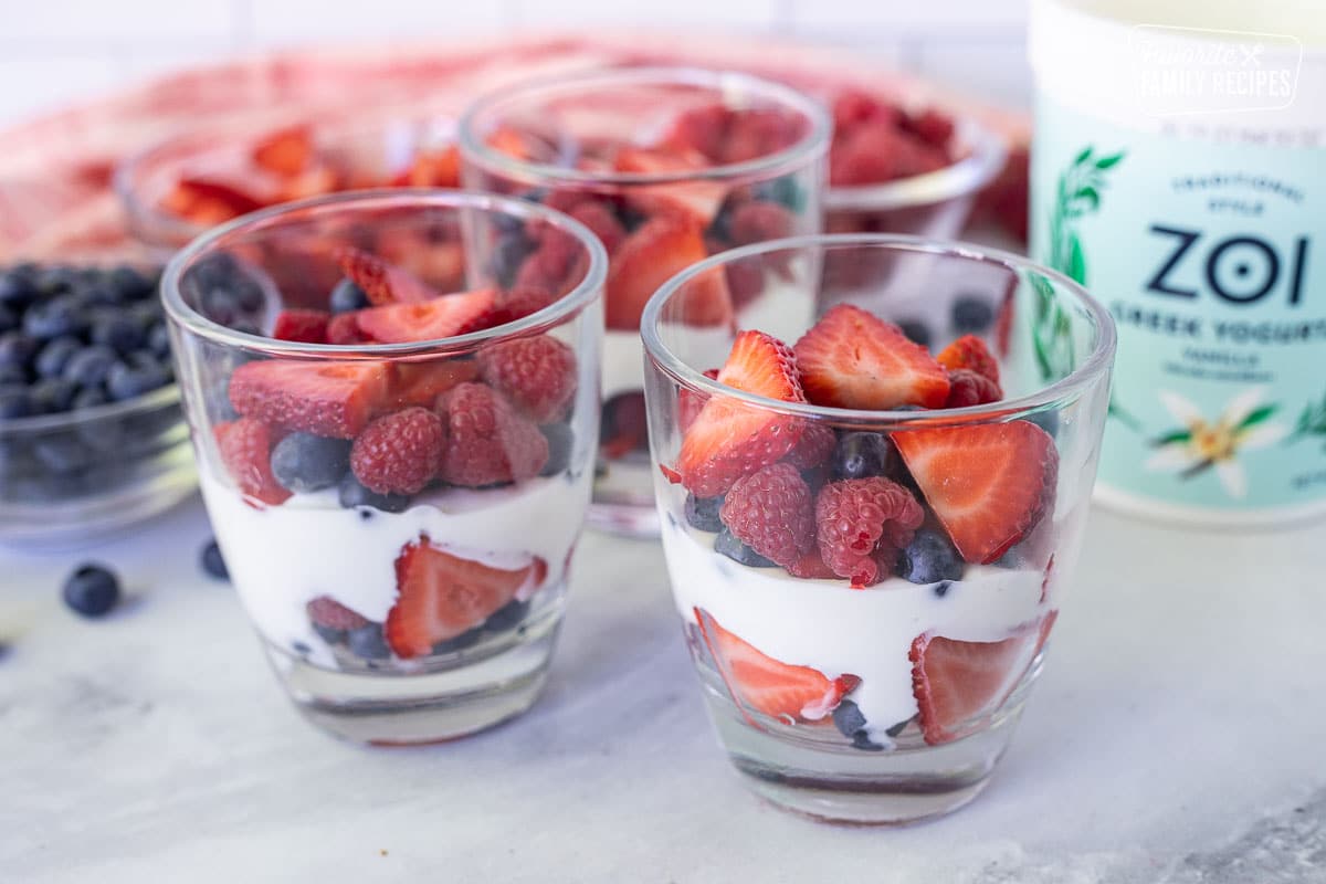 Berry layer added to cup of Breakfast Parfait.