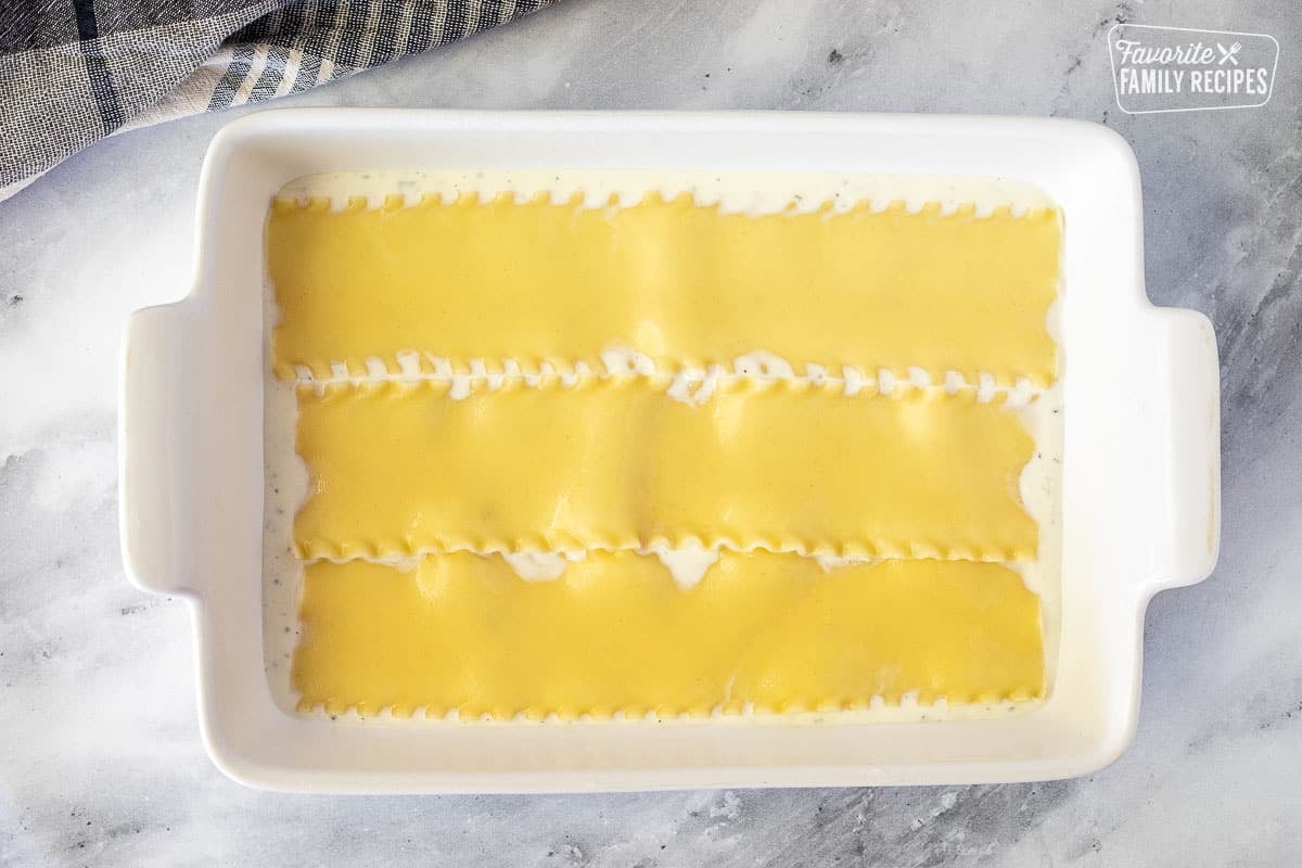 Baking dish with noodle layer for White Chicken Lasagna.