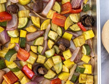 Colorful variety of Oven Roasted Vegetables on a sheet pan.