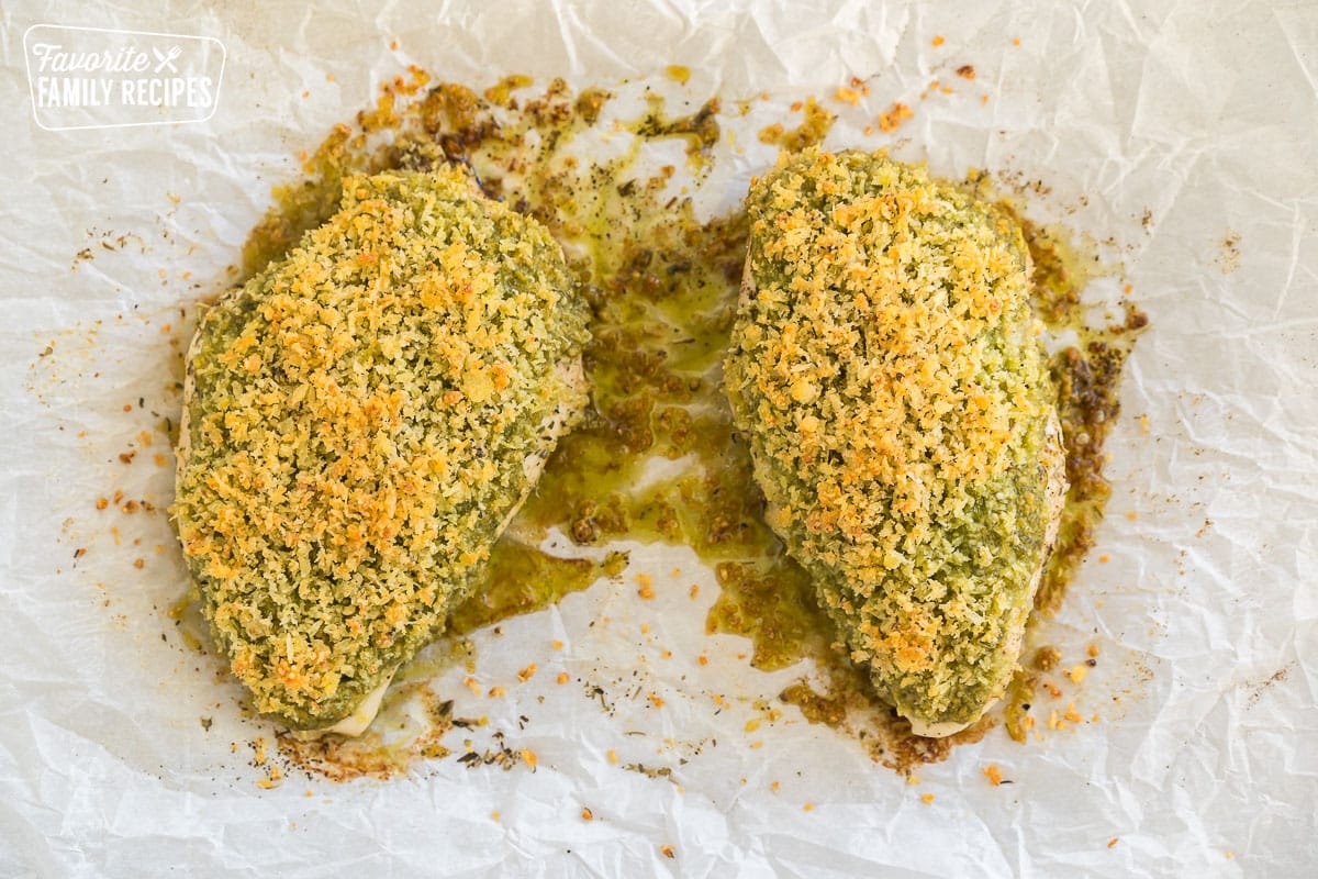 two pieces of baked pesto chicken