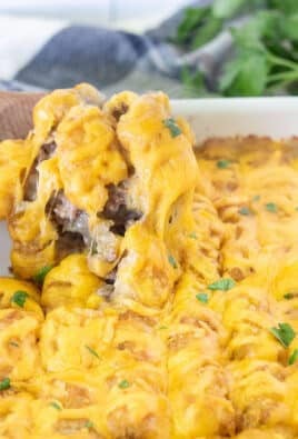 Spoon scooping out a serving of Tater Tot Casserole.