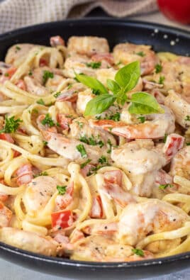 Side view of Creamy Cajun Shrimp Pasta in a skillet.