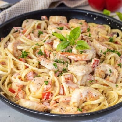 Side view of Creamy Cajun Shrimp Pasta in a skillet.