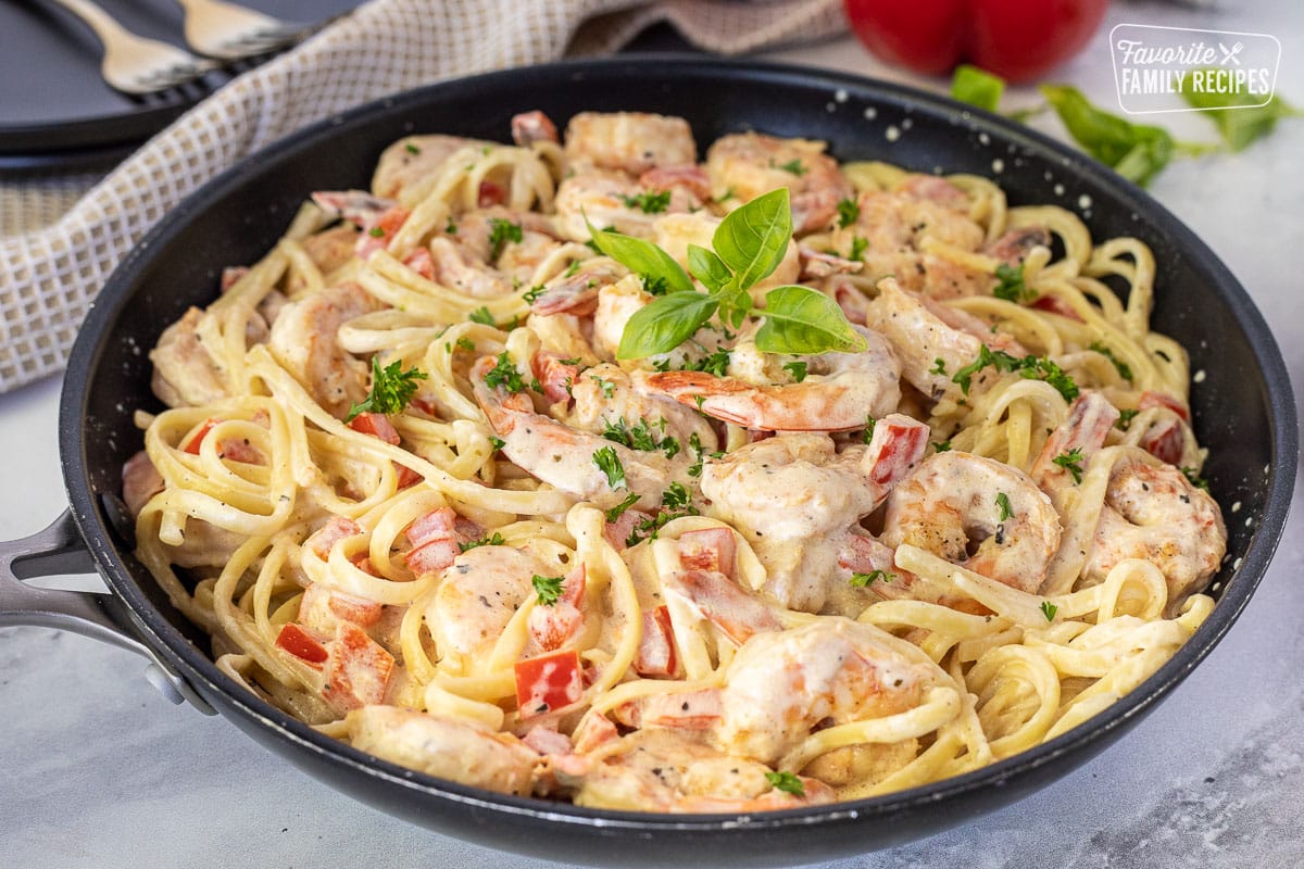 Side view of Creamy Cajun Shrimp Pasta in a skillet.