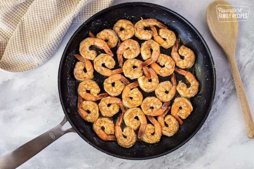 Pink shrimp in skillet for Creamy Cajun Shrimp Pasta.