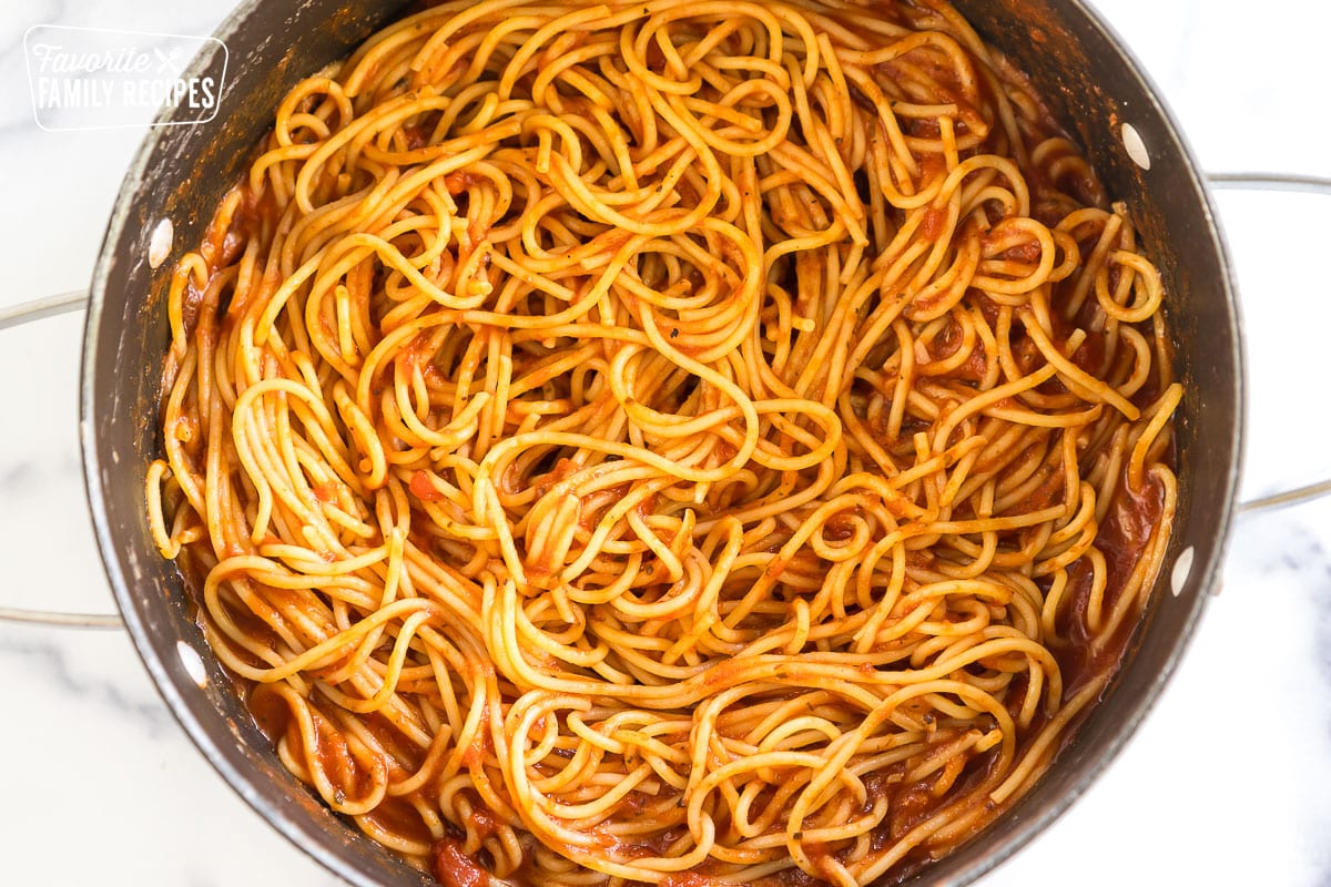 a pot of pasta and red sauce