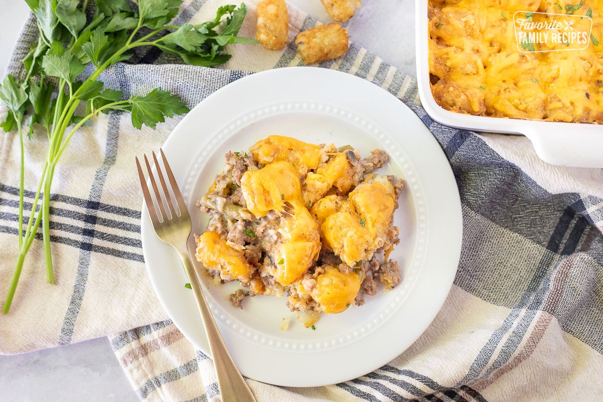 Tater Tot Casserole on a plate with a fork.