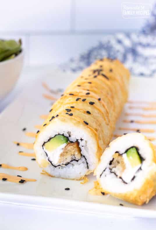 Shrimp Tempura Roll with spicy mayo and black sesame seeds.