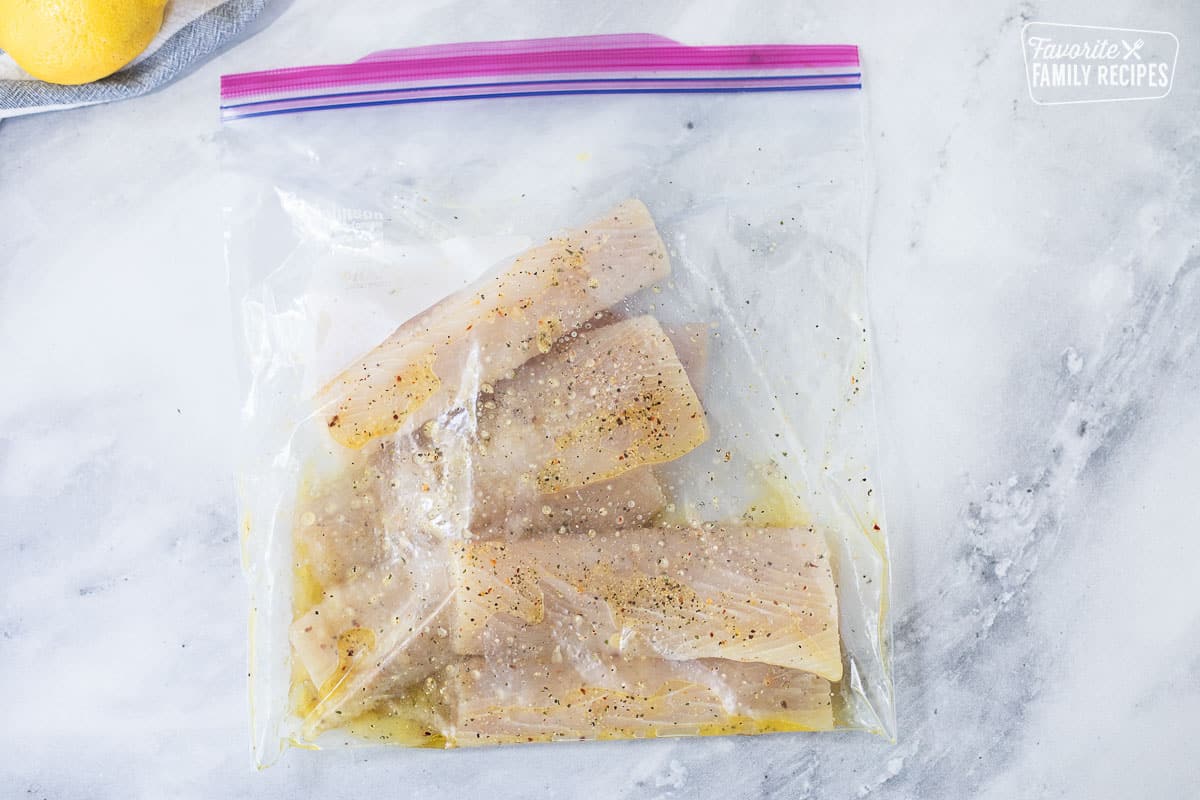 Ziplock bag marinating mahi mahi fillets for Baked Mahi Mahi with Parmesan Crust.