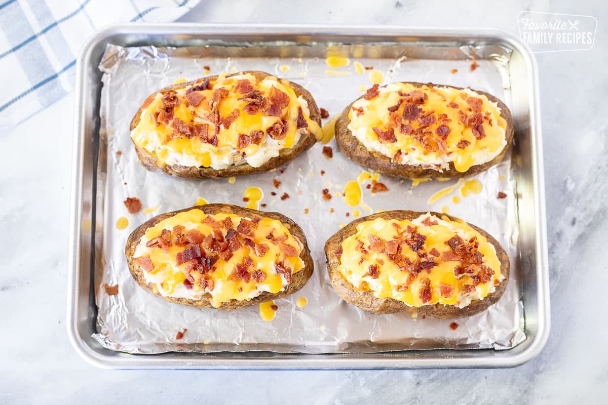 Melted Twice Baked Potatoes on a baking dish.