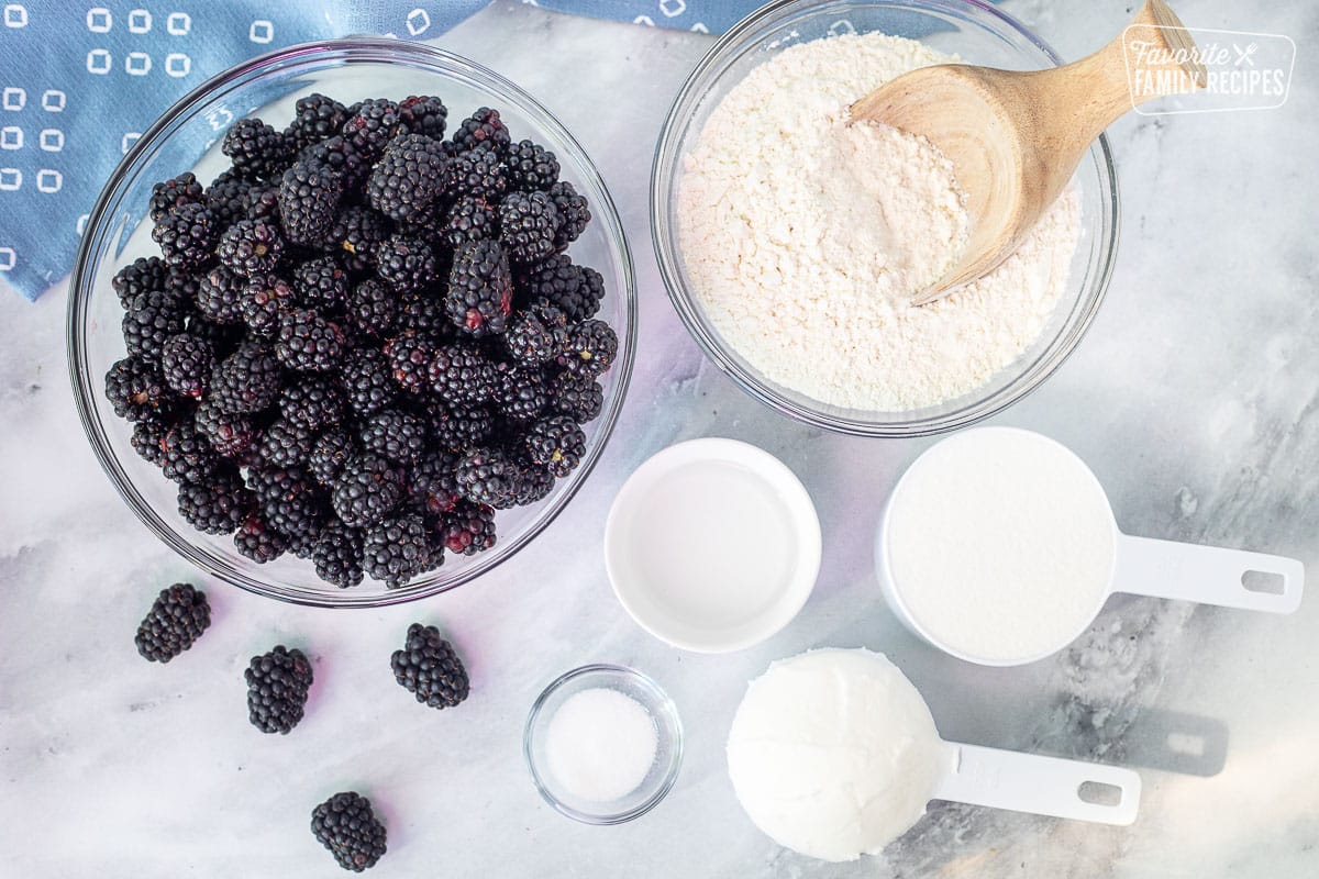 Ingredients to make Blackberry Pie including blackberries, sugar, Crisco shortening, flour, water and salt.