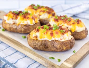 Twice Baked Potatoes with cheddar cheese, bacon and green onion.