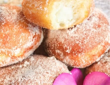 Close up of a malasada showing the filling