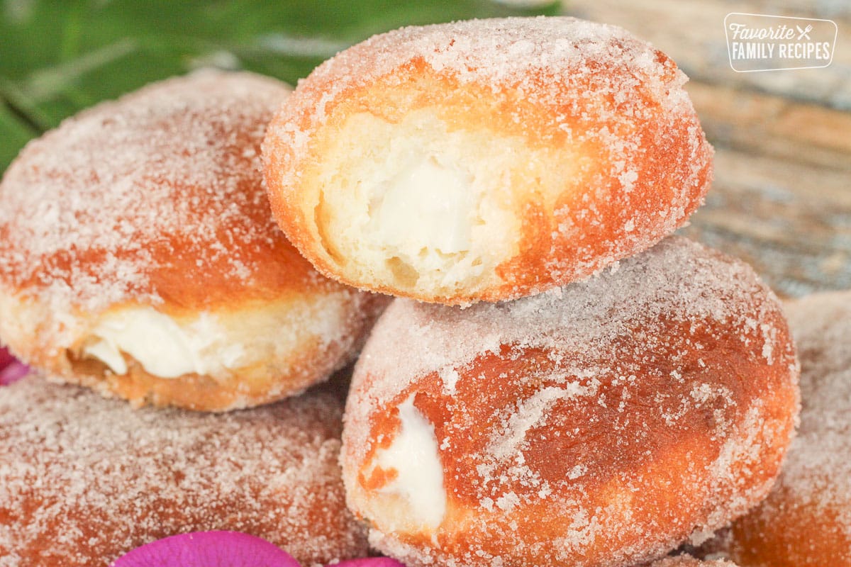 Malasadas on a plate showing the coconut filling