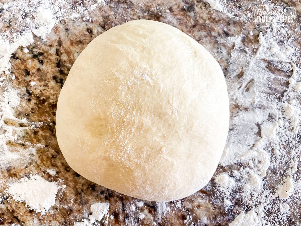 A large ball of dough to make Malasadas