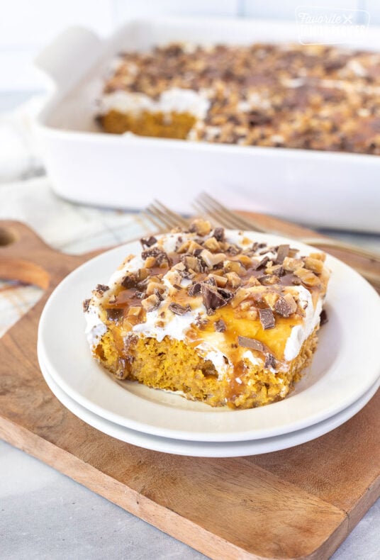 Pumpkin Poke Cake slice on a plate.