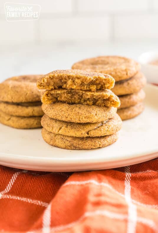 Pumpkin snickerdoodles stacked on top of each other.