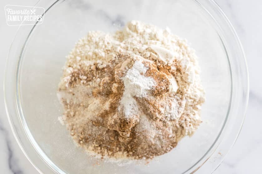 Dry ingredients for cookies in a glass bowl.