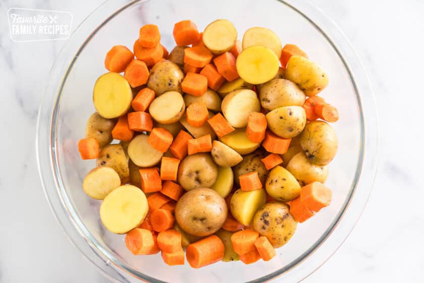 Chopped potatoes and carrots in a bowl