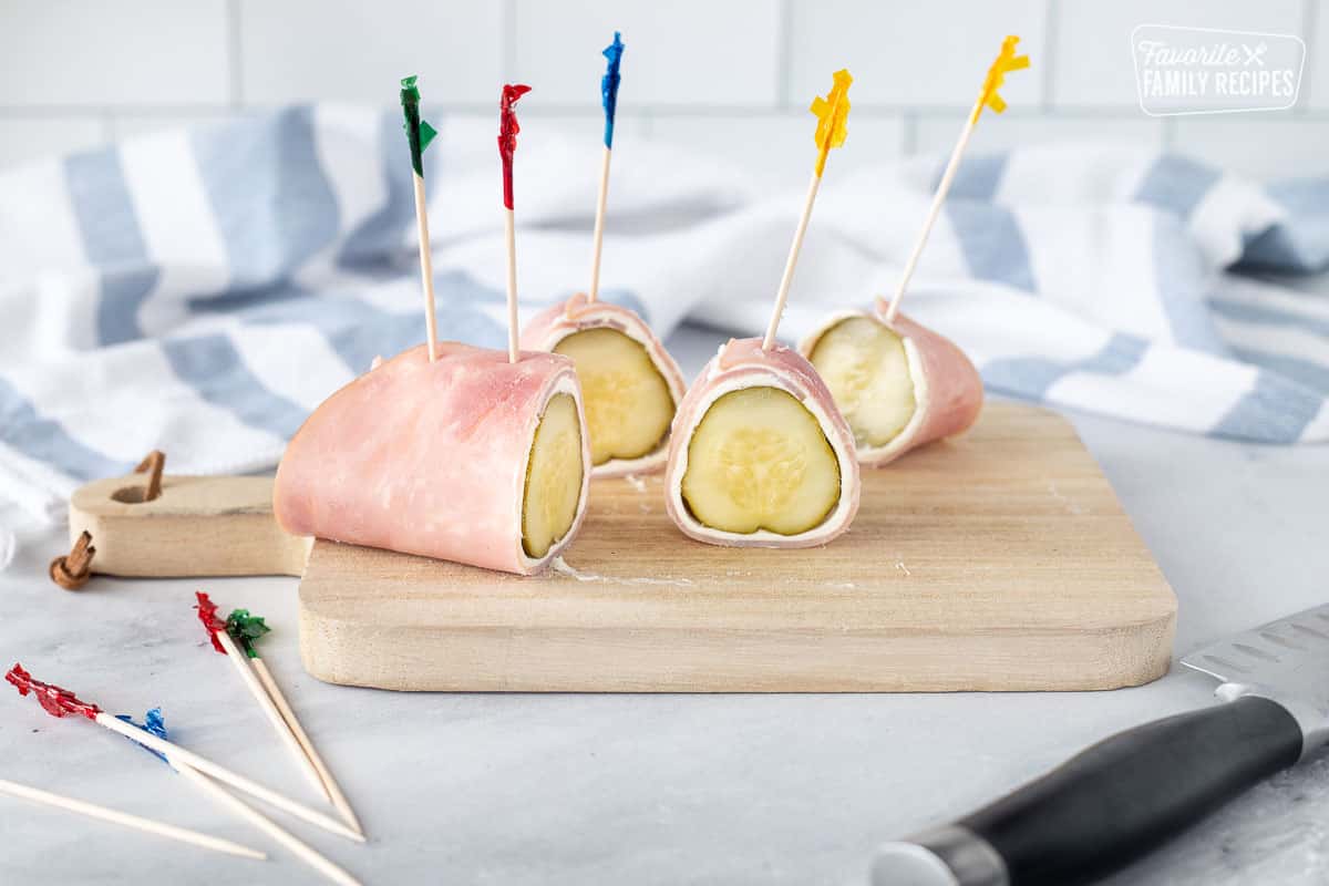 Slicing Ham Roll Up with Pickle.