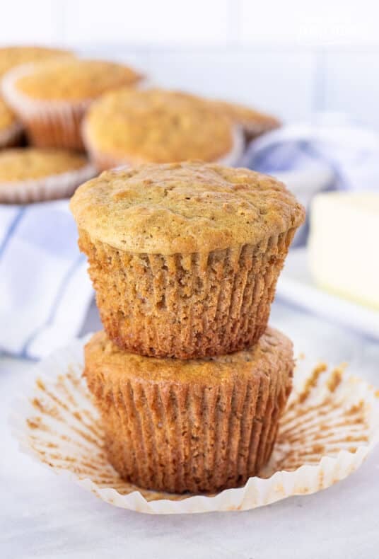 Two stacked Bran Muffins with liners removed.