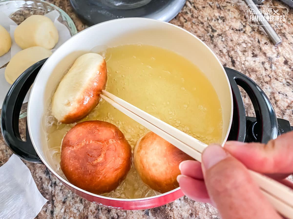 Malasadas in an oil fryer