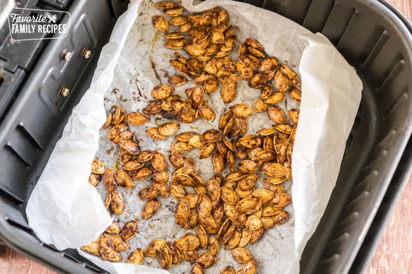 pumpkin seeds cooked in an air fryer basket