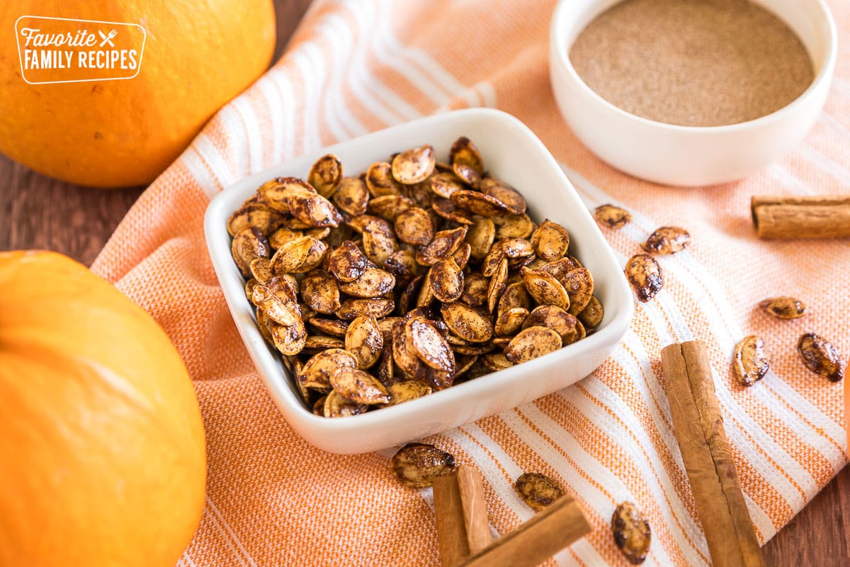 Pumpkin seeds in a small bowl.