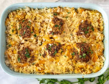 Casserole dish with Cheesy Chicken and Rice Casserole.