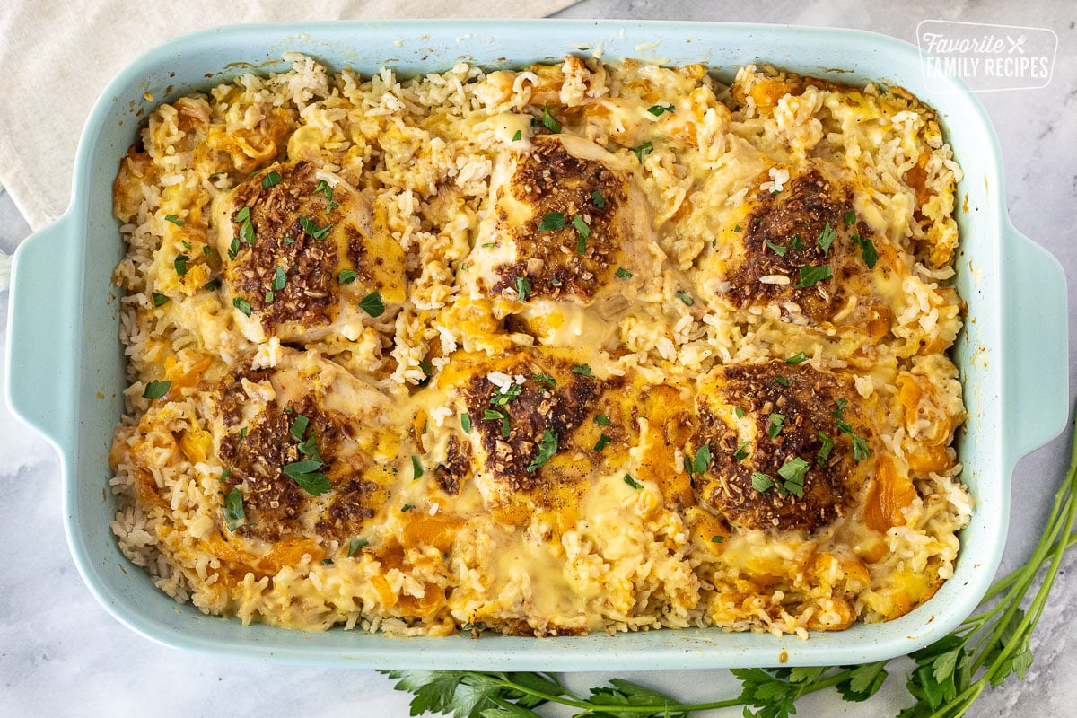 Casserole dish with Cheesy Chicken and Rice Casserole.