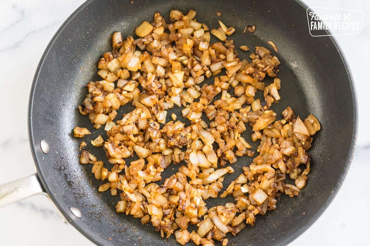 onions, garlic, and spices in a pan