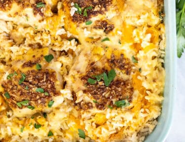 Baked Cheesy Chicken and Rice Casserole in a casserole dish.