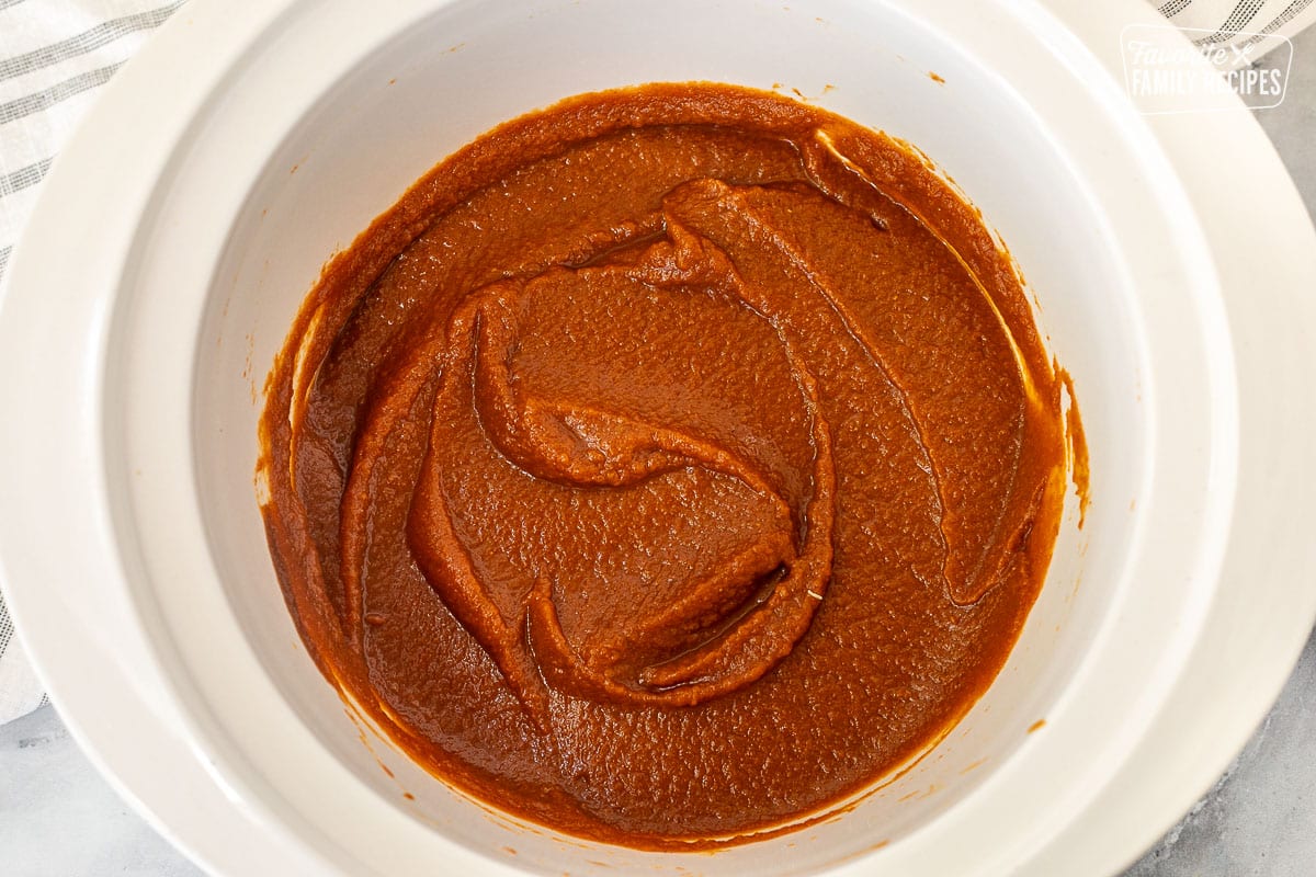 Crockpot with combined ingredients for Pumpkin Butter.