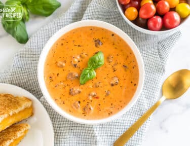 creamy tomato basil soup in a bowl