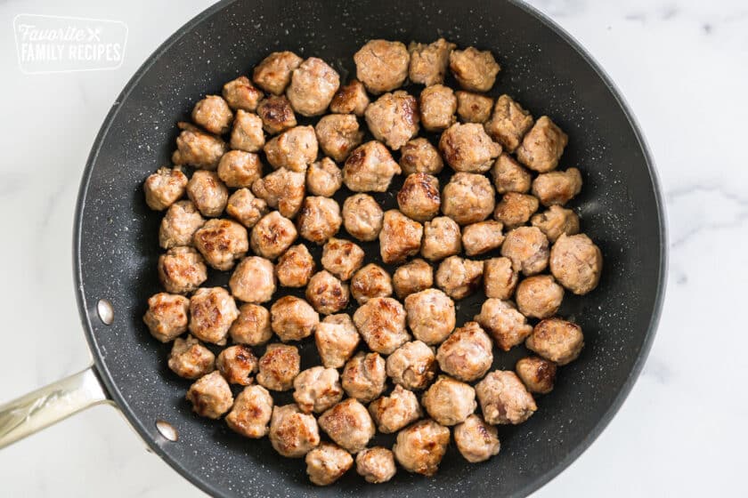 small sausage meatballs in a skillet