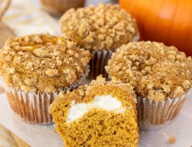 Sliced open Pumpkin Cream Cheese Muffin.