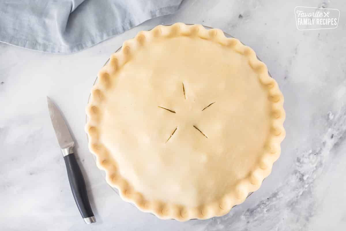 Slicing design on top of Homemade Chicken Pot Pie with a knife.