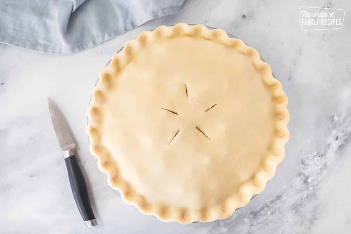 Premium Photo  Homemade hearty kurnik pie with chicken potatoes and rice  on parchment vertical view