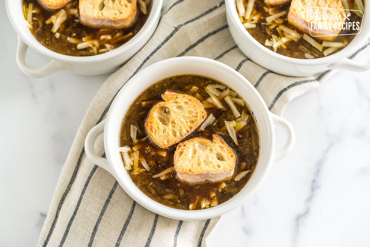 French onion soup in a bowl topped with bread